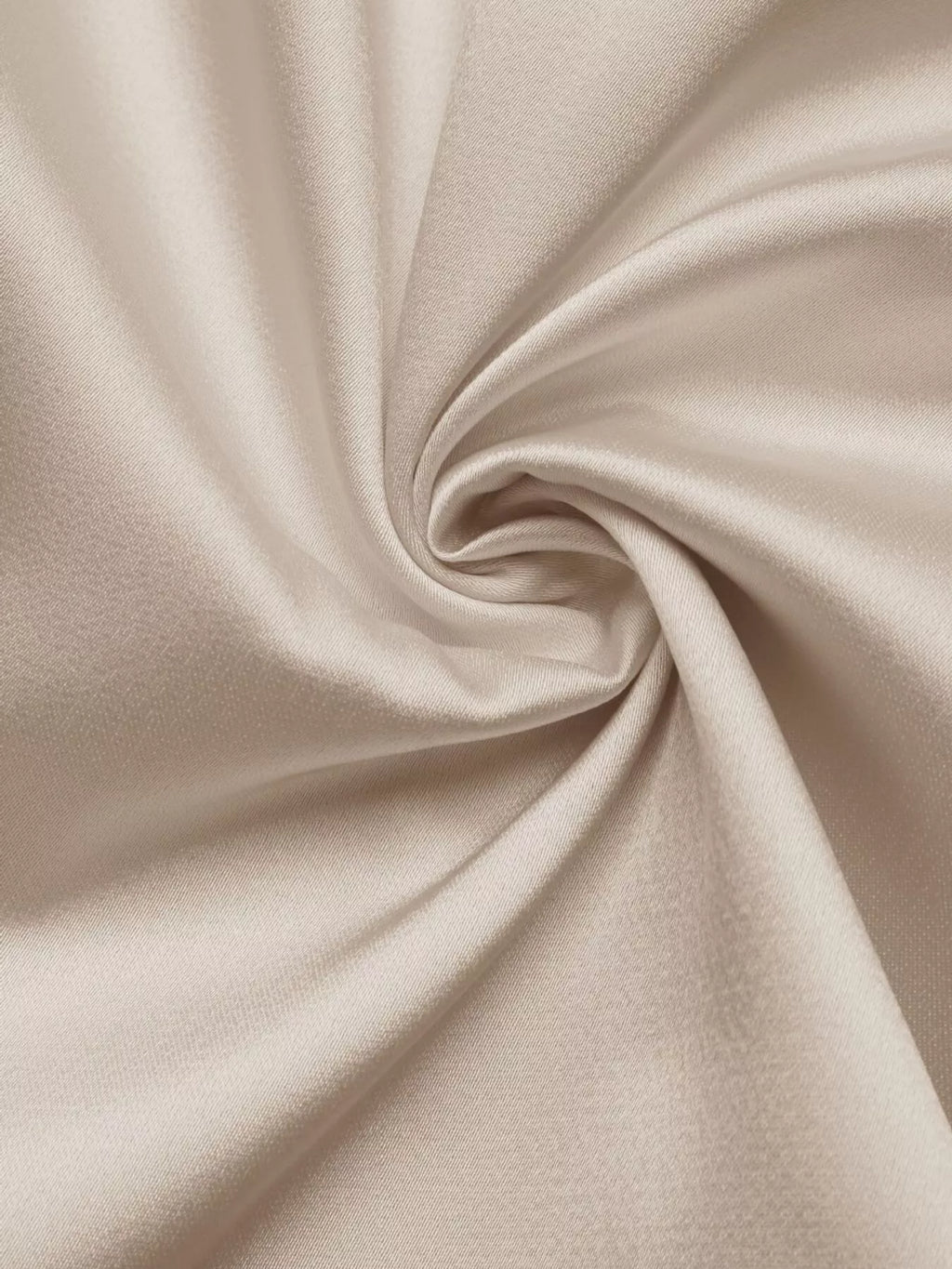 Close-up of beige fabric with folds