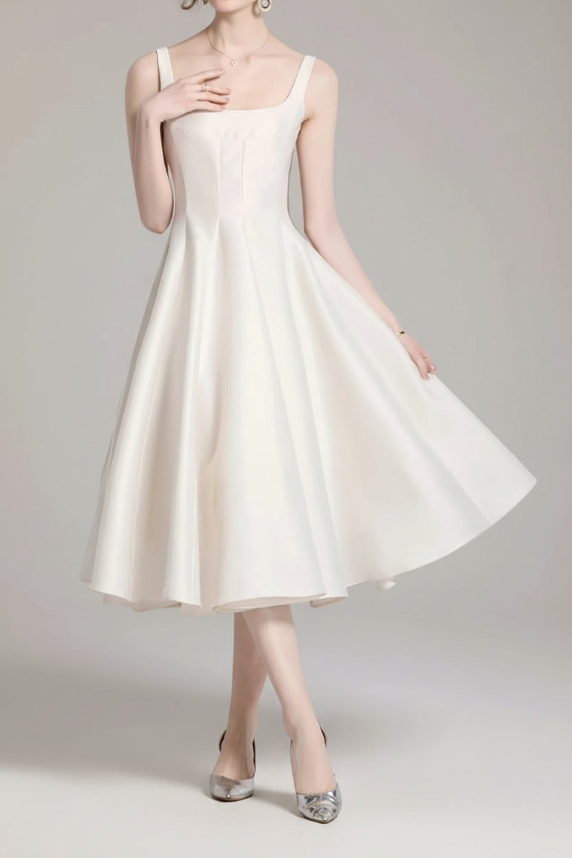 White dress being modeled on a white background