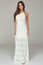 Woman wearing a white dress in a clothing store